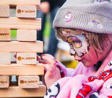 child playing giant jenga
