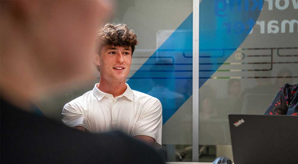 man sitting in meeting room