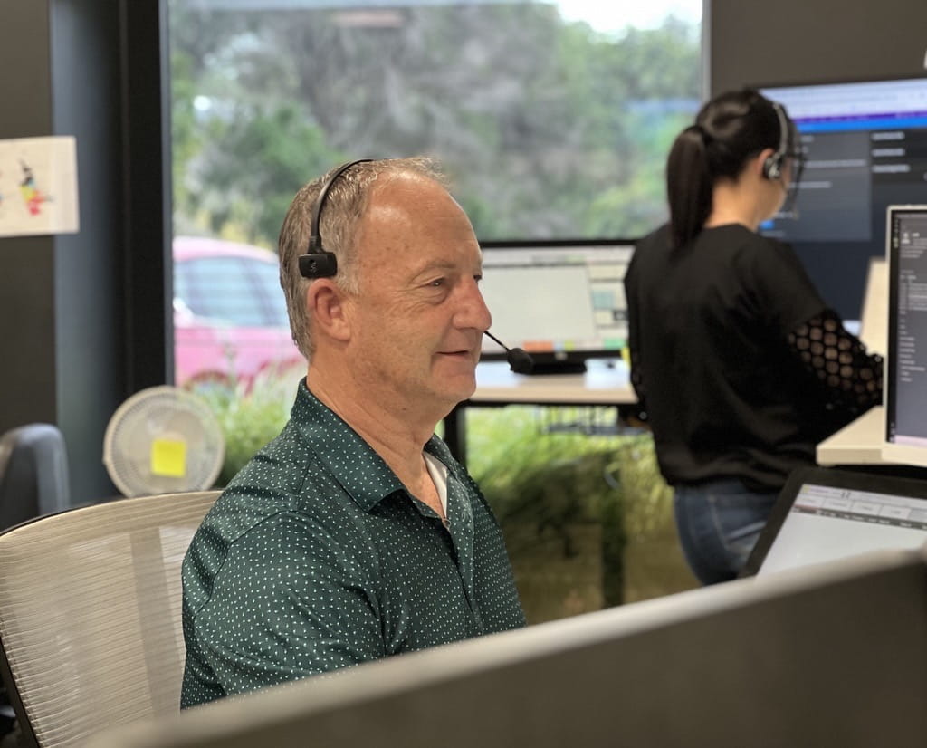man on phone in call centre