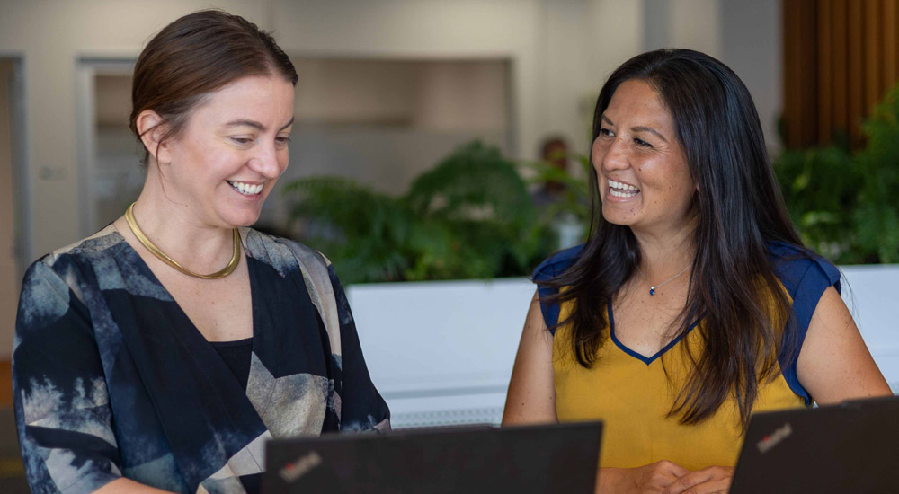 women talking in office