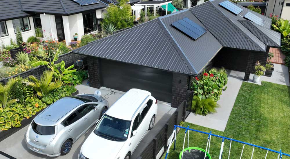arial view of home with solar panels on roof