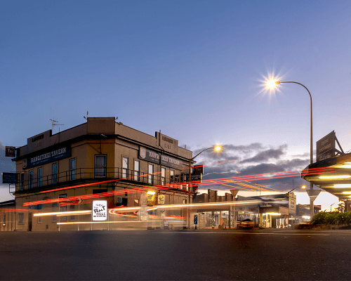 Mainstreet Bulls in lights at night.