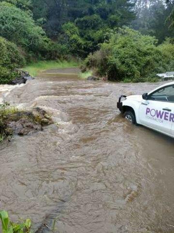 Powerco contractor vehicle stopped by flood waters on Coromandel Peninsuala