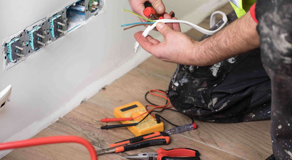 electrician installing power switches