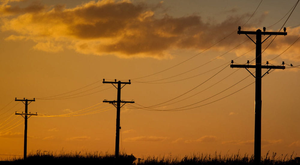 power poles with sun set
