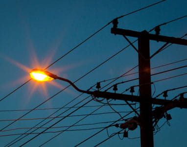 streetlight on power pole at dusk