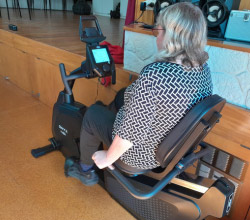 woman using exercise bike