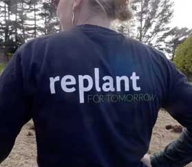 Woman wearing replant for tomorrow t shirt