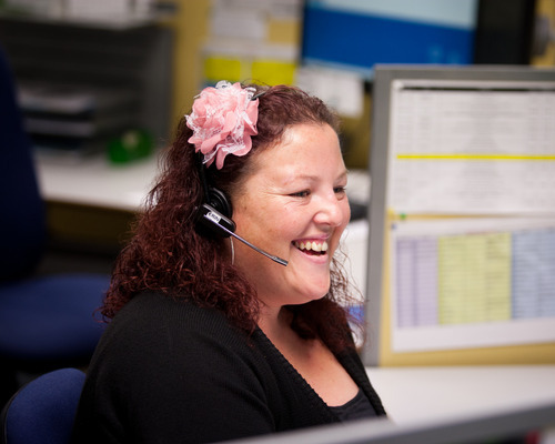 woman smiling while on phone