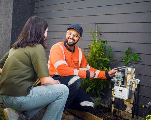 Man installing gas smart meter at house